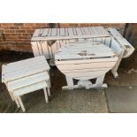 A modern white painted teak garden set to include a drop flap rectangular table 146cm wide;...