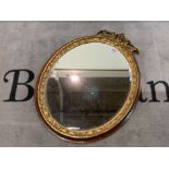 A late Victorian oval giltwood wall mirror