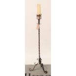 An 18th century style wrought iron floor standing candlestick