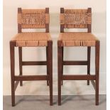 A pair of modern oak and rope bar stools