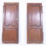 A pair of 19th century fruitwood arched armoire doors