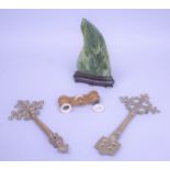 A Nephrite carving, a pair of Opera glasses and two brass keys