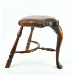 A mid-18th century style cock fighting stool, on cabriole and turned supports united by...