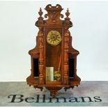 A 19th century walnut cased Vienna regulator wall clock, with glazed door flanked by small...