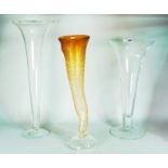 An amber glass cornucopia flower vase