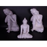 A pair of modern resin figures of Buddha and another similar
