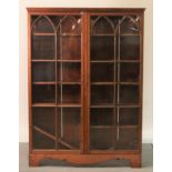 A late 19th century stained pine floor standing display cabinet