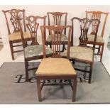 A matched set of eleven various late George III dining chairs