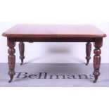 A Victorian mahogany extending dining table