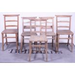 A matched set of five early 20th century beech and elm chapel chairs