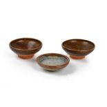 A pair of Chinese brown glazed tea bowls