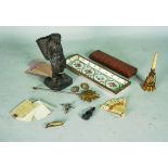 Collectibles including A bronze figure of a man carrying a basket (qty)