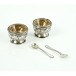 J and W Deakin; a pair of cased footed salts hall marked Chester 1901, together with a pair of...