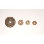 Four various Chinese coins