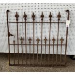 An early 20th century cast iron garden gate