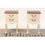 A pair of modern white painted two drawer bedside tables