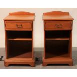 A pair of modern pine bedside tables