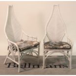 A pair of mid 20th century white painted faux bamboo open armchairs