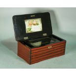 An early 20th century Swiss music box within a faux rosewood box