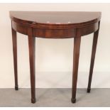 A George III mahogany fold over card table