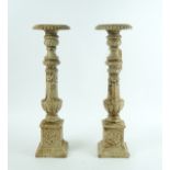 A pair of 17th century style white painted cast iron pricket candlesticks, with swag mounted...