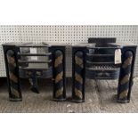 A pair of Victorian black painted and parcel gilt decorated fire baskets