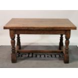 An 18th century style oak drop end extending refectory table