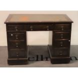 An early 20th century oak pedestal desk