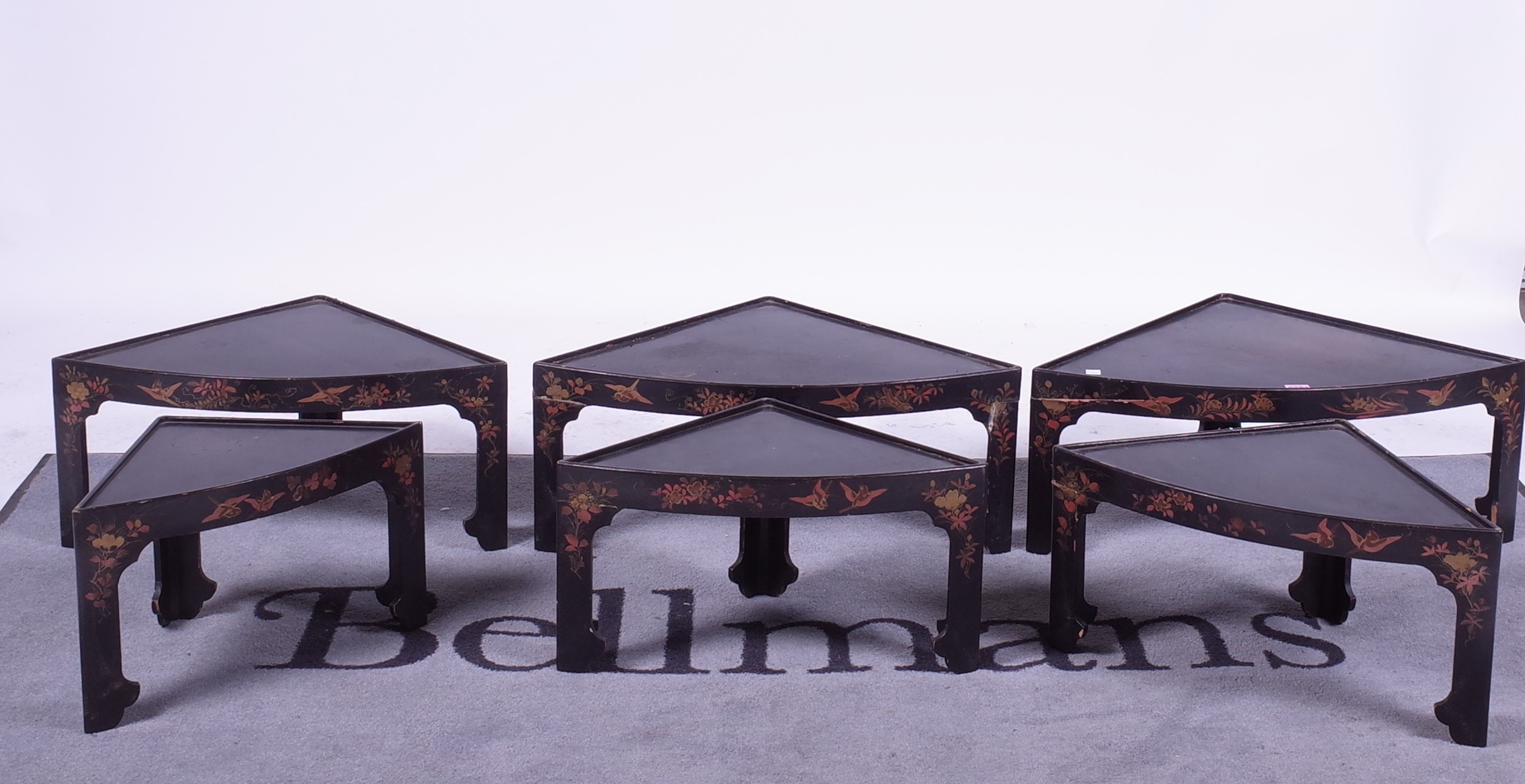 An early 20th century chinoiserie decorated nest of six tables