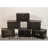 A set of six early 20th century black painted trunks