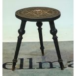A 20th century Eastern carved tripod table. 41cm wide.