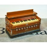 A Bina walnut cased Harmonium