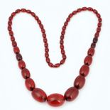 A single row necklace of reconstituted translucent amber beads
