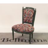 An 18th century and later French green painted low side chair