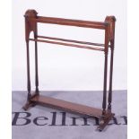 An Edwardian inlaid mahogany towel rail