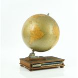 Rand McNally; a 12 inch terrestrial desk globe, with integral atlas reference book stand