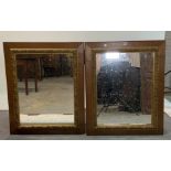 A pair of early 20th century oak and parcel gilt decorated rectangular wall mirrors