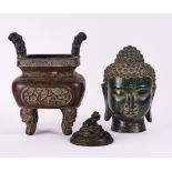 A SOUTH-EAST ASIAN GREEN PATINATED METAL HEAD OF BUDDHA AND A BRONZE JARDINIERE (3)