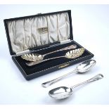 TWO SILVER FRUIT SERVING SPOONS AND TWO FURTHER SILVER SPOONS (3)