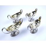 A SET OF FOUR GEORGE III SILVER TWIN HANDLED SALTS