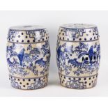 A PAIR OF CHINESE STYLE BLUE AND WHITE GLAZED CERAMIC BARREL SHAPED GARDEN SEATS (2)