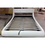 A MODERN FAUX WHITE LEATHER UPHOLSTERED KING SIZE BED