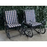 A PAIR OF MODERN BLACK PAINTED METAL ROCKING ARMCHAIRS