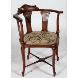 AN EDWARDIAN INLAID MAHOGANY CORNER CHAIR