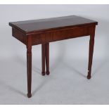 A GEORGE III MAHOGANY FOLDOVER TEA TABLE