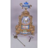 A GILT METAL MOUNTED MANTLE CLOCK WITH PORCEALIN MOUNTS