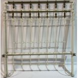 A LATE VICTORIAN WHITE PAINTED CAST IRON DOUBLE BED