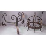 A LATE 19TH CENTURY WROUGHT IRON CAULDRON STAND (2)