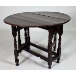 A 17TH CENTURY OAK DROP FLAP GATE LEG TABLE