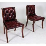 A PAIR OF MODERN STAINED BEECH FRAMED AND RED LEATHER UPHOLSTERED SIDE CHAIRS